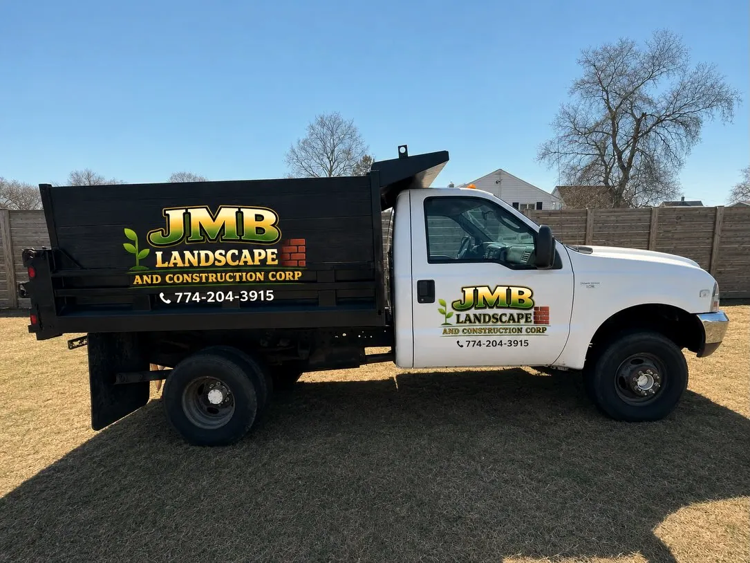JMB Landscape and Construction dump truck, side view
